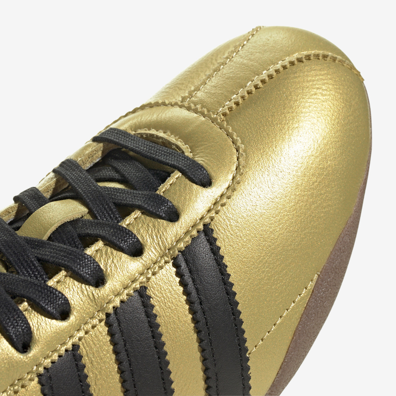 adidas Tokyo shoes with a soft leather upper, serrated 3-Stripes, and a low-profile rubber sole, inspired by vintage track and field trainers.