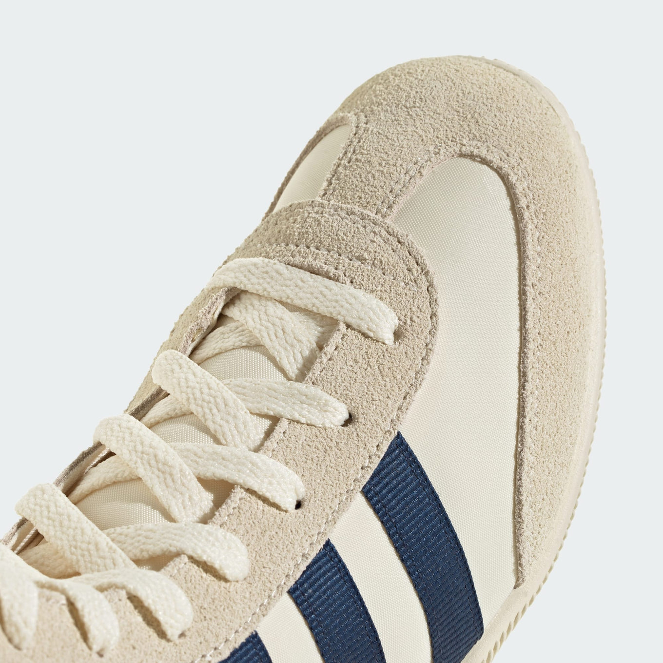 adidas Japan High Shoes featuring a high-top nylon and suede upper, extended tongue, lace-up closure, EVA wedge sole, and bold 3-Stripes with gold-letter branding.