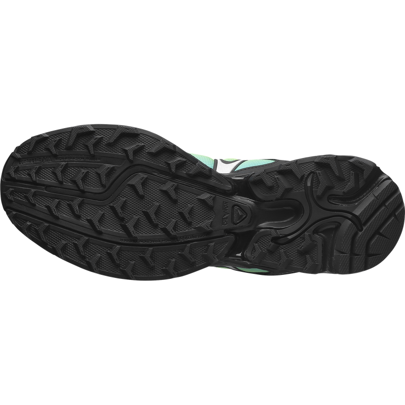 Salomon XT-Whisper sneaker with a textured, layered design, wavy Sensifit™ technology, Quicklace system, and a premium material upper for enhanced fit and style.