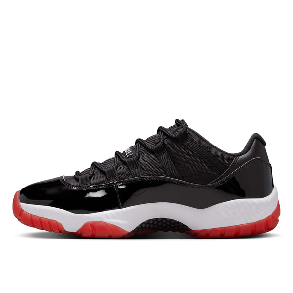 Air Jordan 11 "Bred" Low sneaker with black patent leather and red accents, inspired by Michael Jordan's 1996 championship run