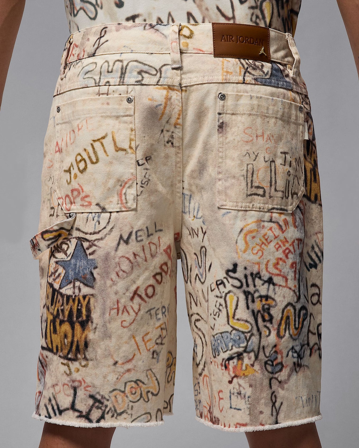 Air Jordan cotton twill shorts with MJ-inspired graphics, reinforced knees, and raw edge hems