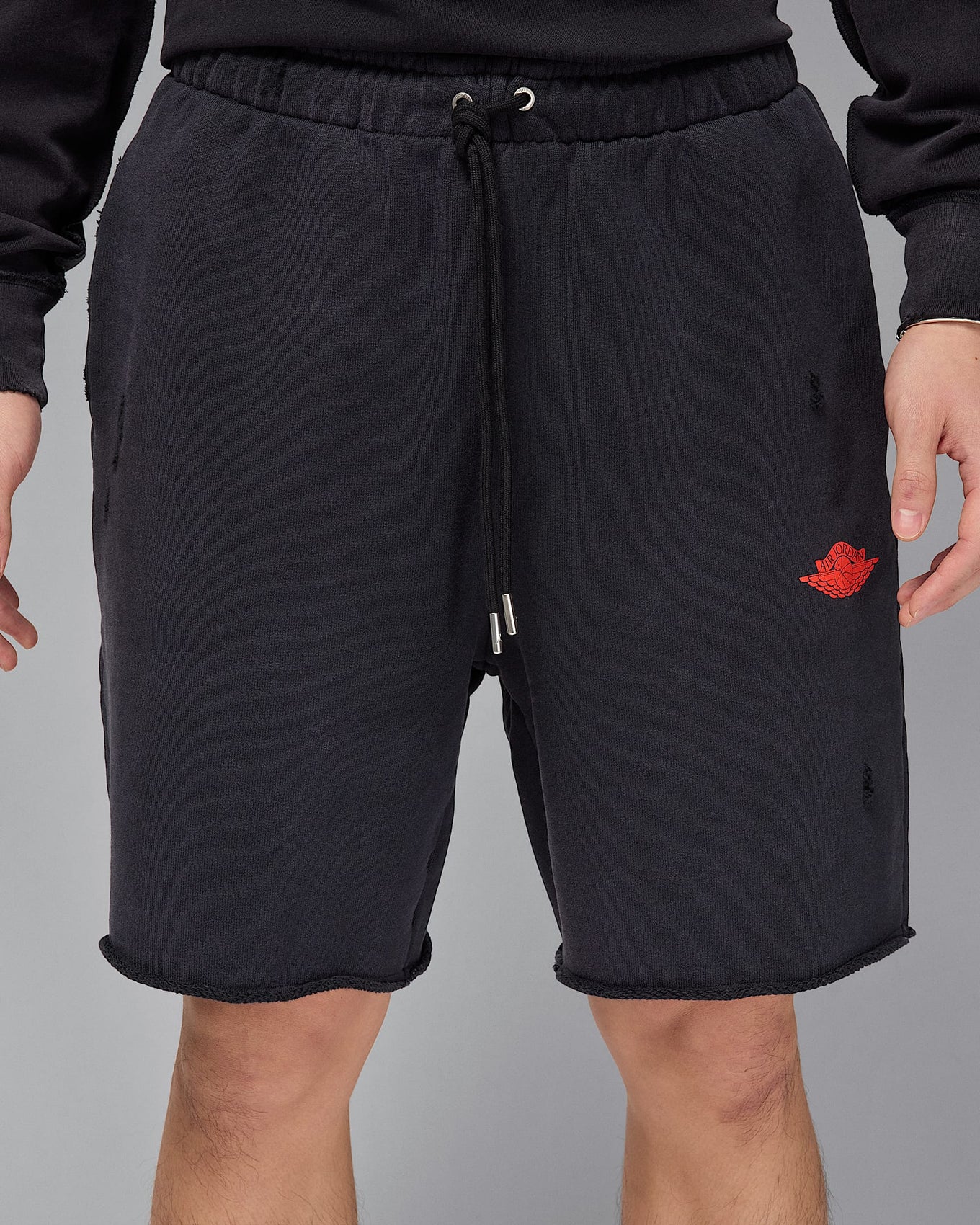 Jordan Rare Air shorts in heavyweight French terry with distressed details, raw edge hems, and crackle print graphics
