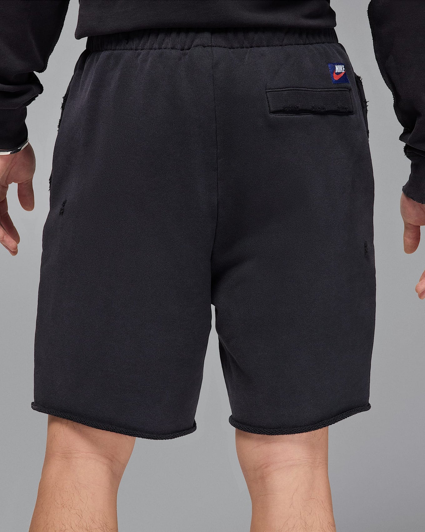 Jordan Rare Air shorts in heavyweight French terry with distressed details, raw edge hems, and crackle print graphics

