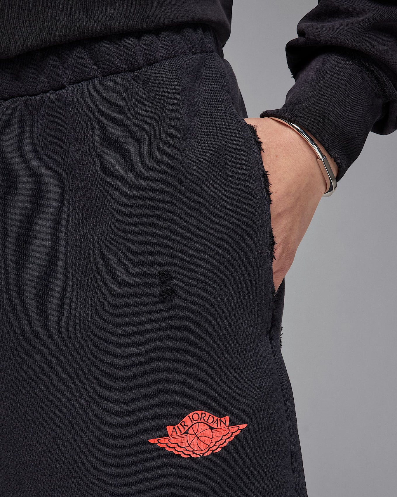 Jordan Rare Air shorts in heavyweight French terry with distressed details, raw edge hems, and crackle print graphics
