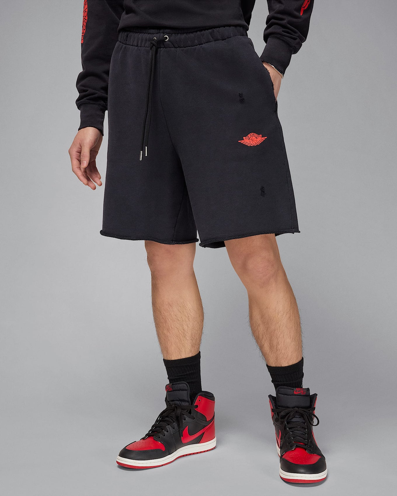 Jordan Rare Air shorts in heavyweight French terry with distressed details, raw edge hems, and crackle print graphics
