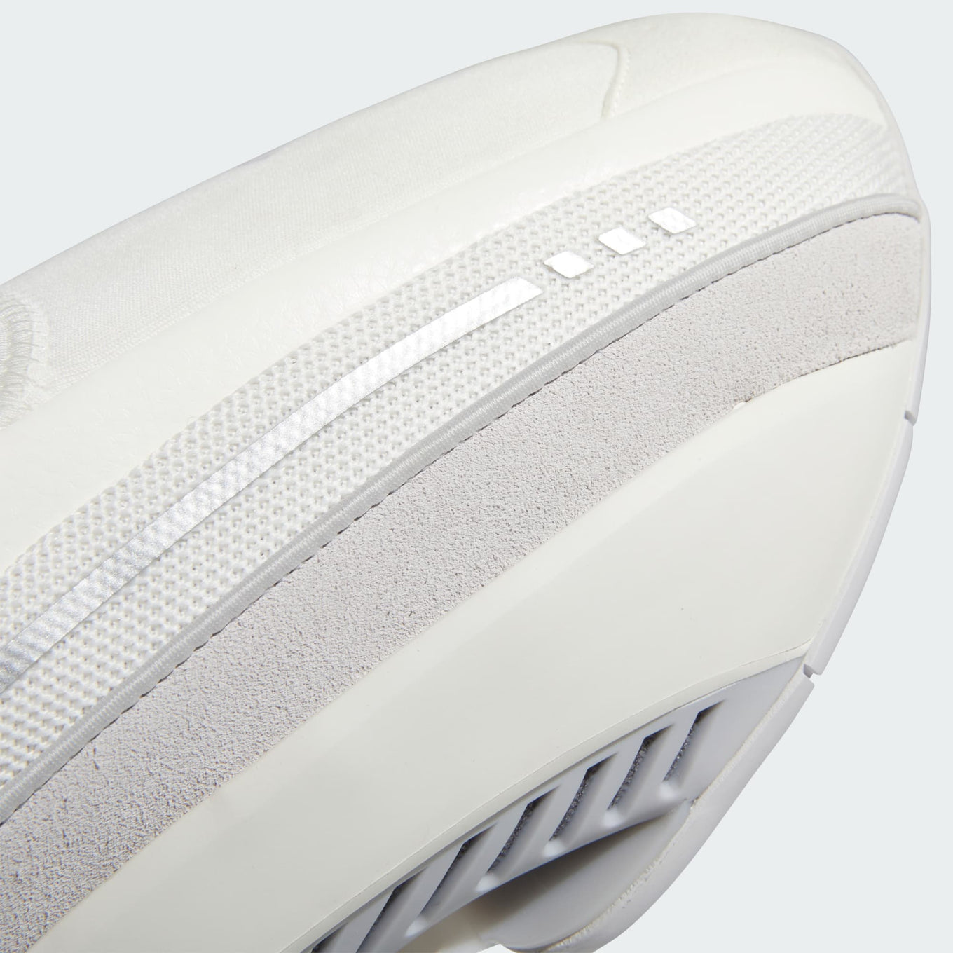 adidas shoes inspired by 2000s basketball, featuring a mixed-material upper and TPU shank for comfort and style.