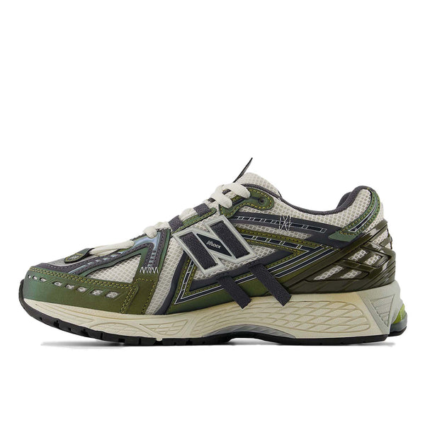 New Balance 1906A sneakers with mesh upper and ABZORB SBS heel cushioning in a retro running silhouette.
