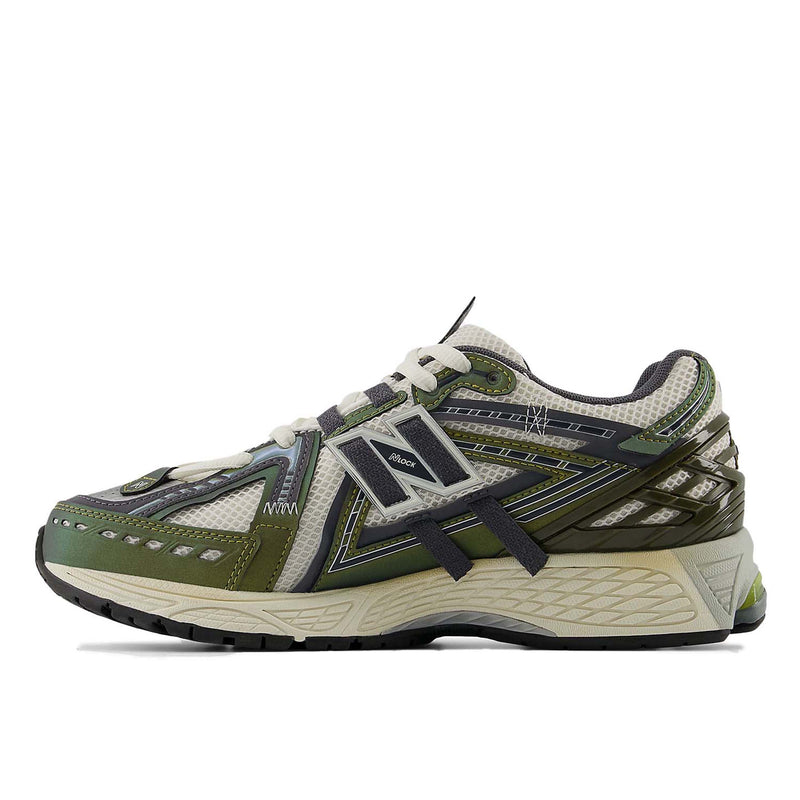 New Balance 1906A sneakers with mesh upper and ABZORB SBS heel cushioning in a retro running silhouette.