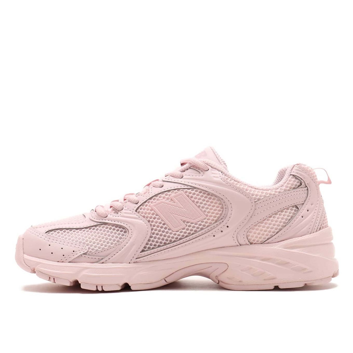 New Balance 530 sneaker in exclusive light pink colorway, featuring elegant curves and ABZORB midsole for spring-ready style.