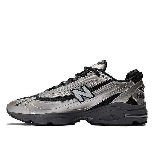 New Balance 1000 sneakers with inverted mesh and suede upper, segmented sole, and ABZORB cushioning in a retro-futuristic design