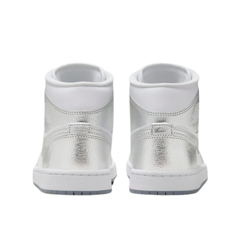 Air Jordan 1 mid-top sneaker, featuring a chrome-like upper that sparkles and catches the eye.