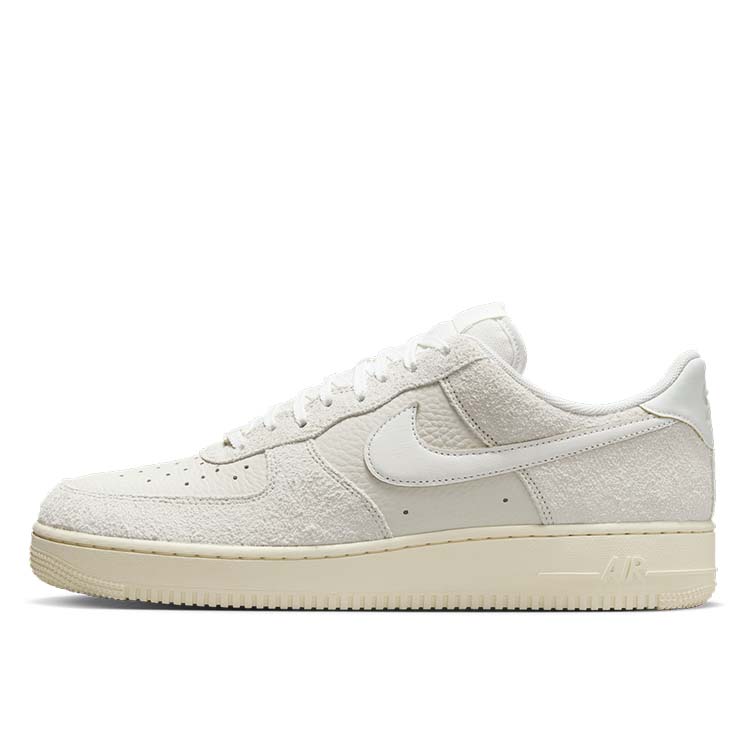 Nike Air Force 1 sneaker in Phantom and Light Bone with tumbled leather, shaggy suede details, and Coconut Milk accents for a neutral, stylish look.
