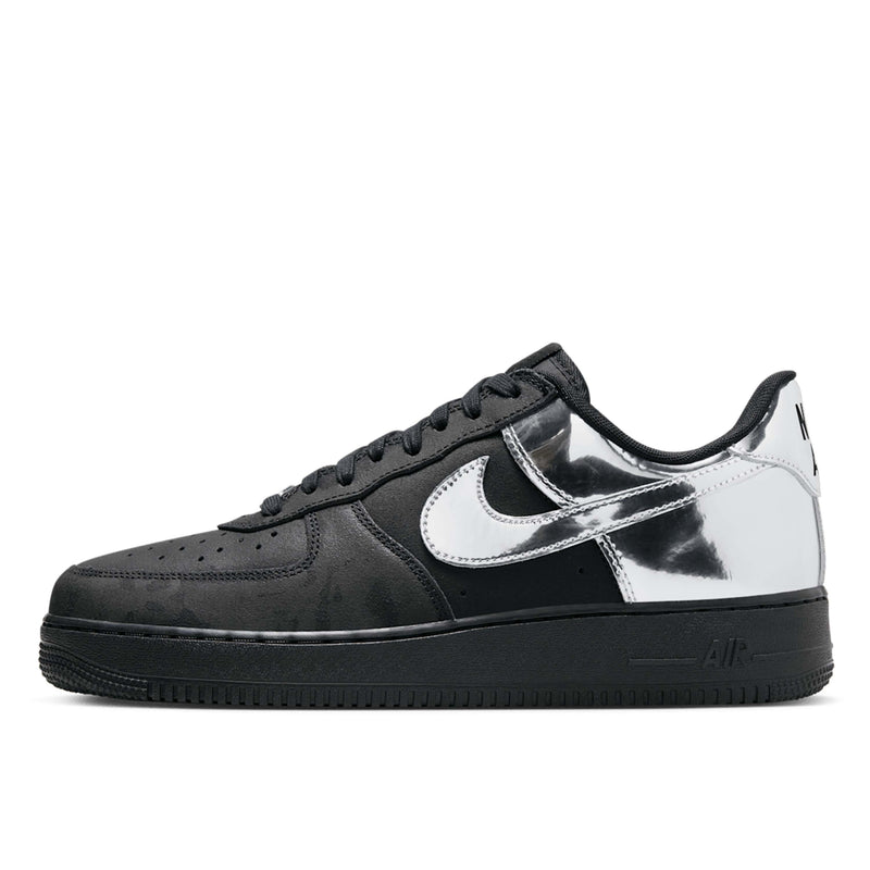 Nike Air Force 1 shoes with black suede upper, chrome accents, reflective graffiti print, and star-shaped dubraes inspired by hip-hop culture