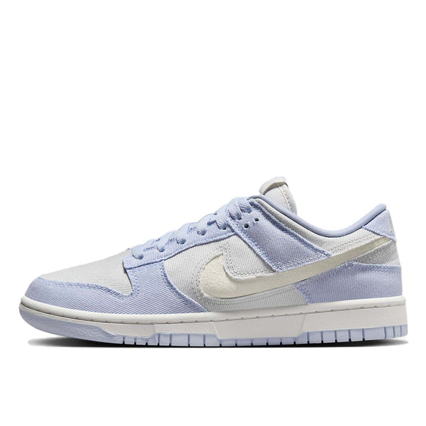 Dunk Low sneaker with iconic color blocking, corduroy layers, and plush padding for comfort and style.