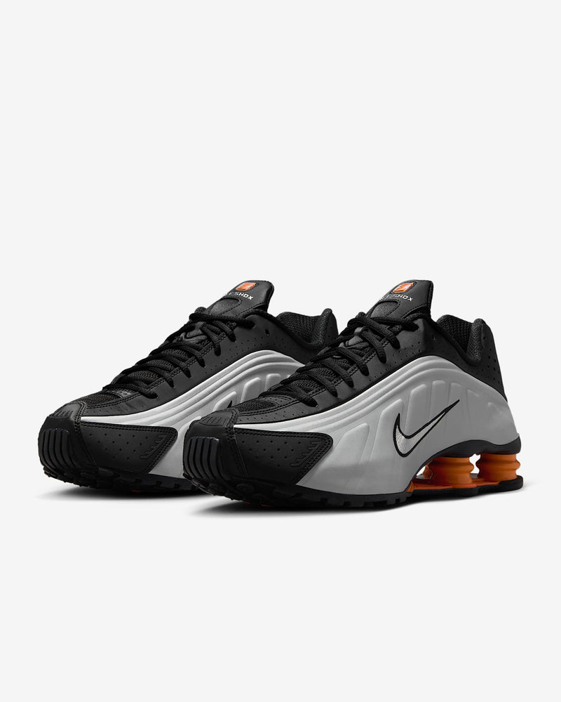 Nike Shox R4 sneaker with metallic finish and signature Shox heel columns for cushioning and futuristic style