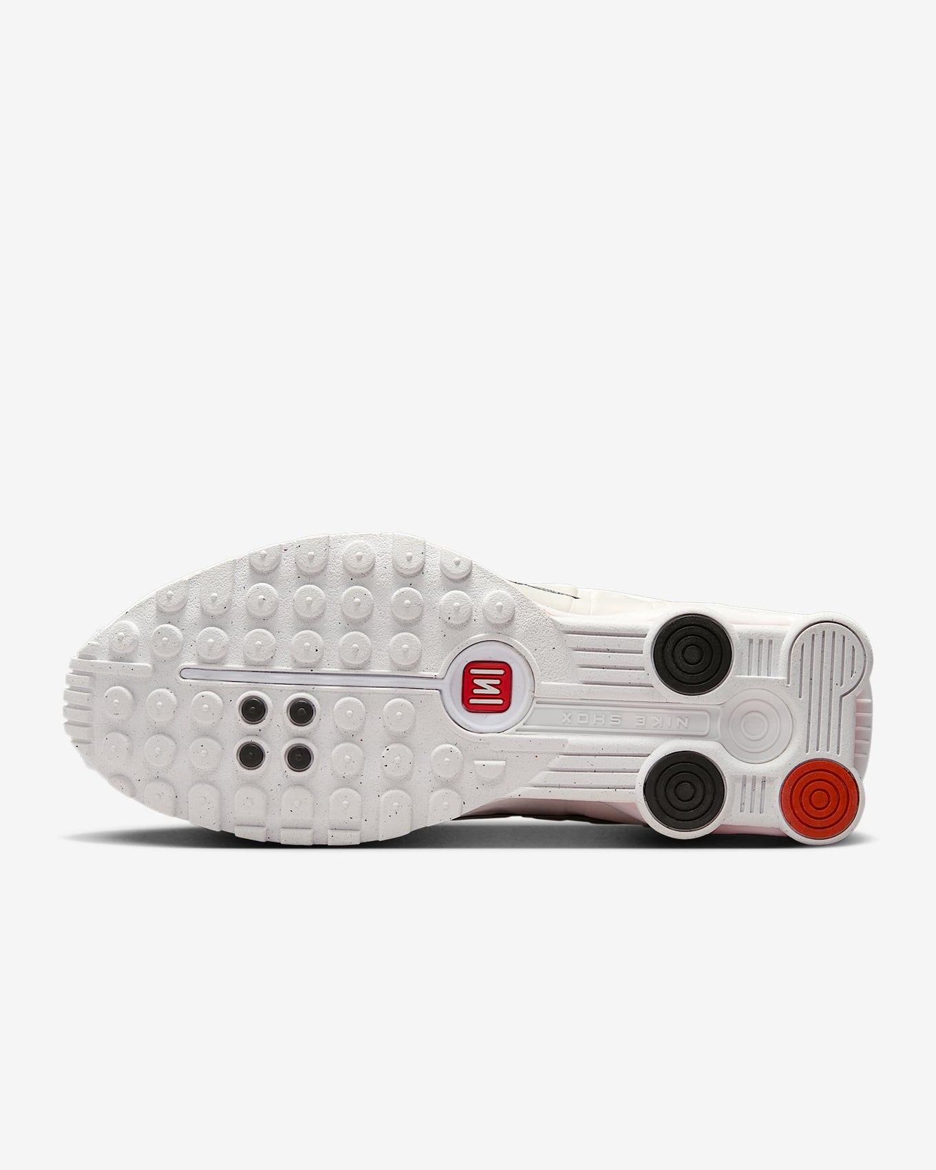 Nike Shox R4 shoes with synthetic and textile upper, laser perforations, and signature Shox cushioning columns in the heel