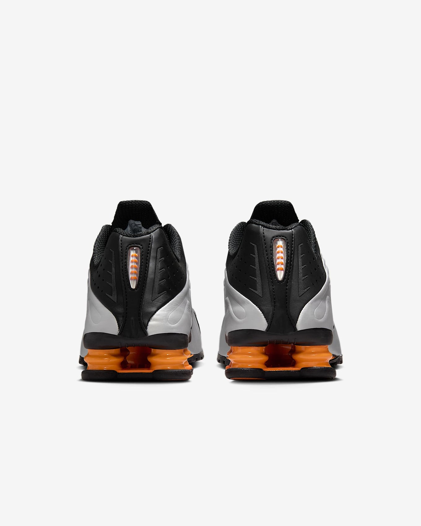 Nike Shox R4 sneaker with metallic finish and signature Shox heel columns for cushioning and futuristic style