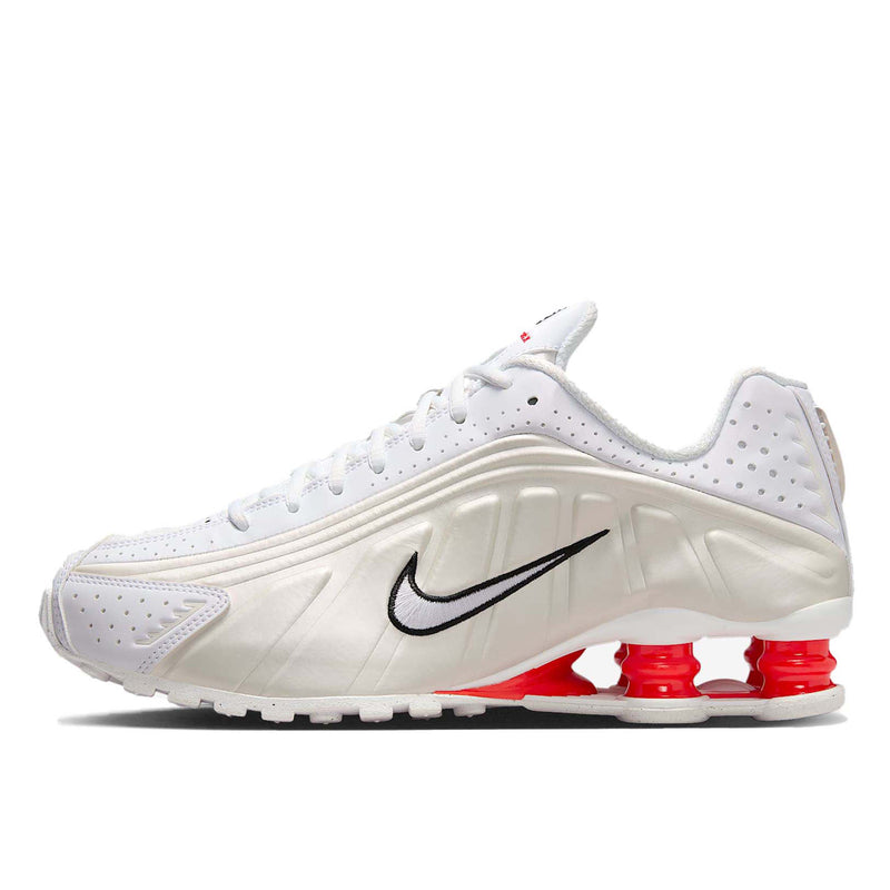 Nike Shox R4 shoes with synthetic and textile upper, laser perforations, and signature Shox cushioning columns in the heel