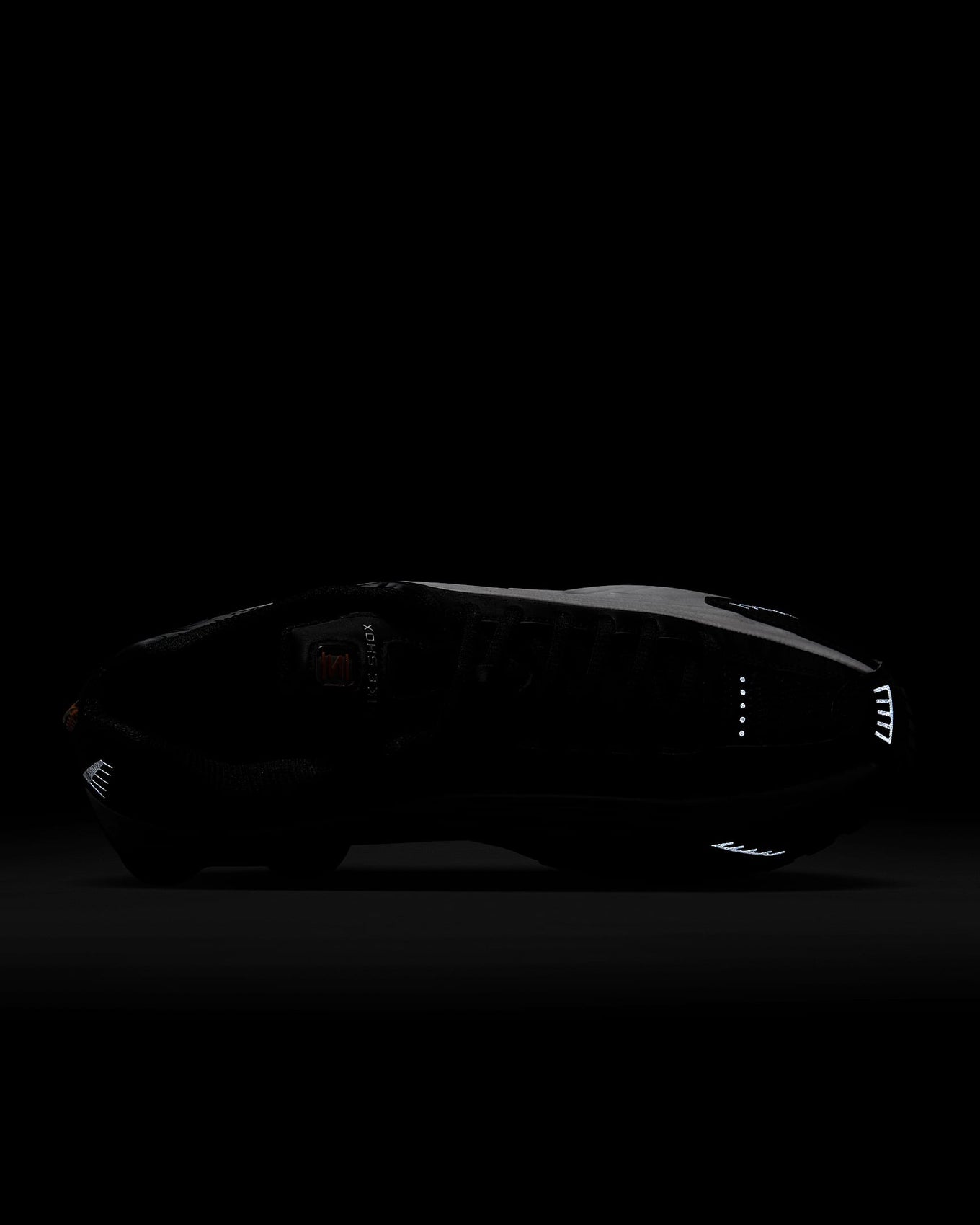 Nike Shox R4 sneaker with metallic finish and signature Shox heel columns for cushioning and futuristic style