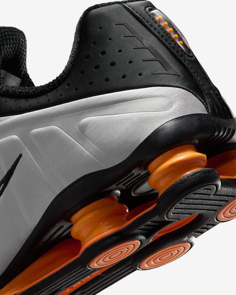 Nike Shox R4 sneaker with metallic finish and signature Shox heel columns for cushioning and futuristic style