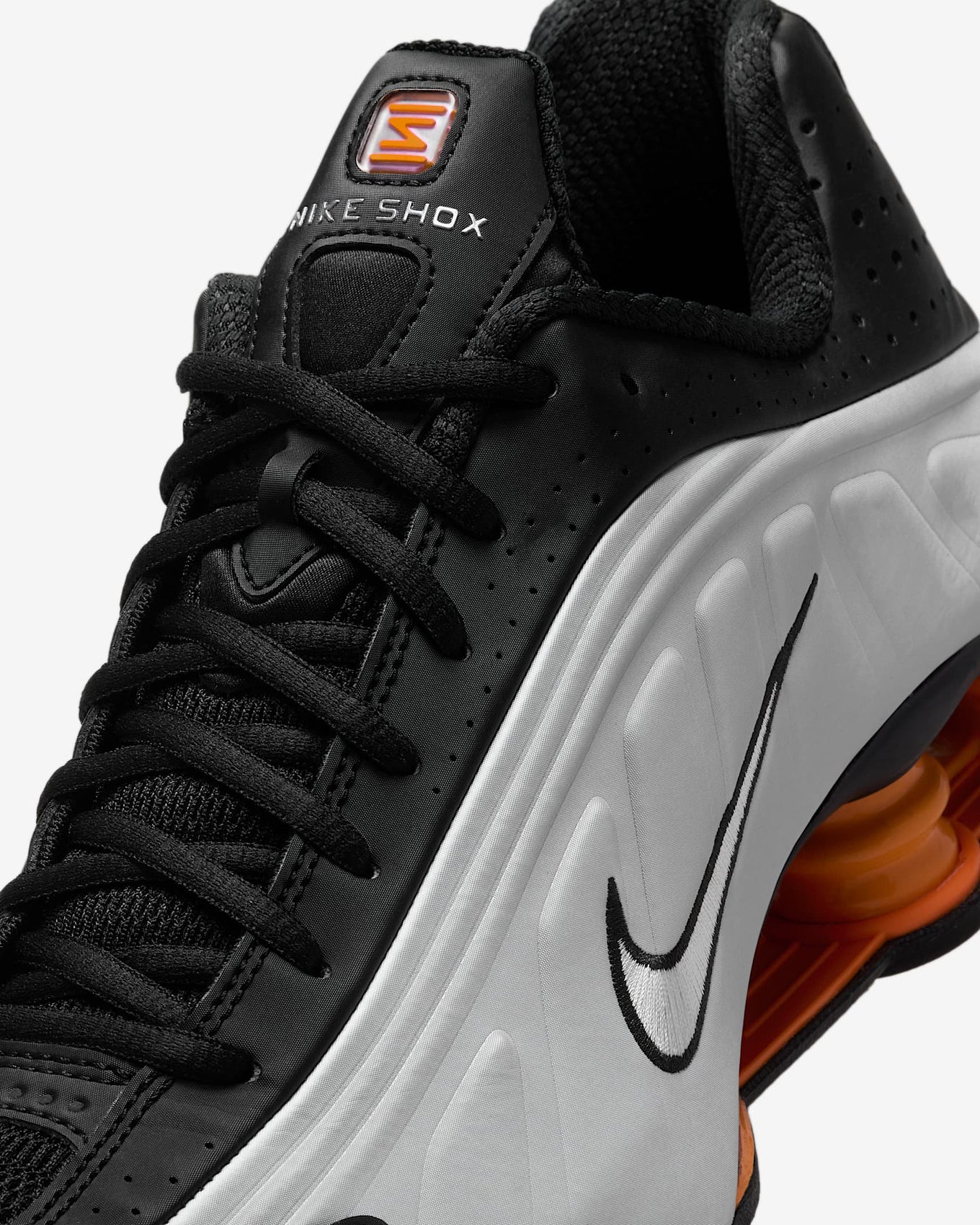 Nike Shox R4 sneaker with metallic finish and signature Shox heel columns for cushioning and futuristic style