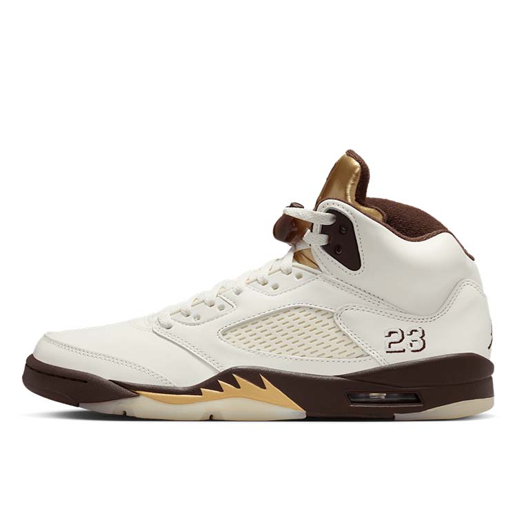 Air Jordan 5 ‘Golden Ticket’ sneaker with Sail leather, Earth-toned midsole, Metallic Gold tongue, and signature lace locks.