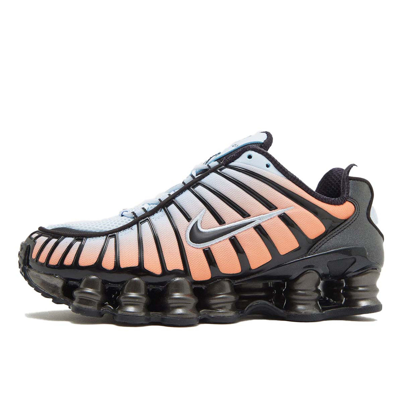 Nike Shox TL sneaker featuring a breathable mesh upper and full-length Shox cushioning in a bold, street-ready design.