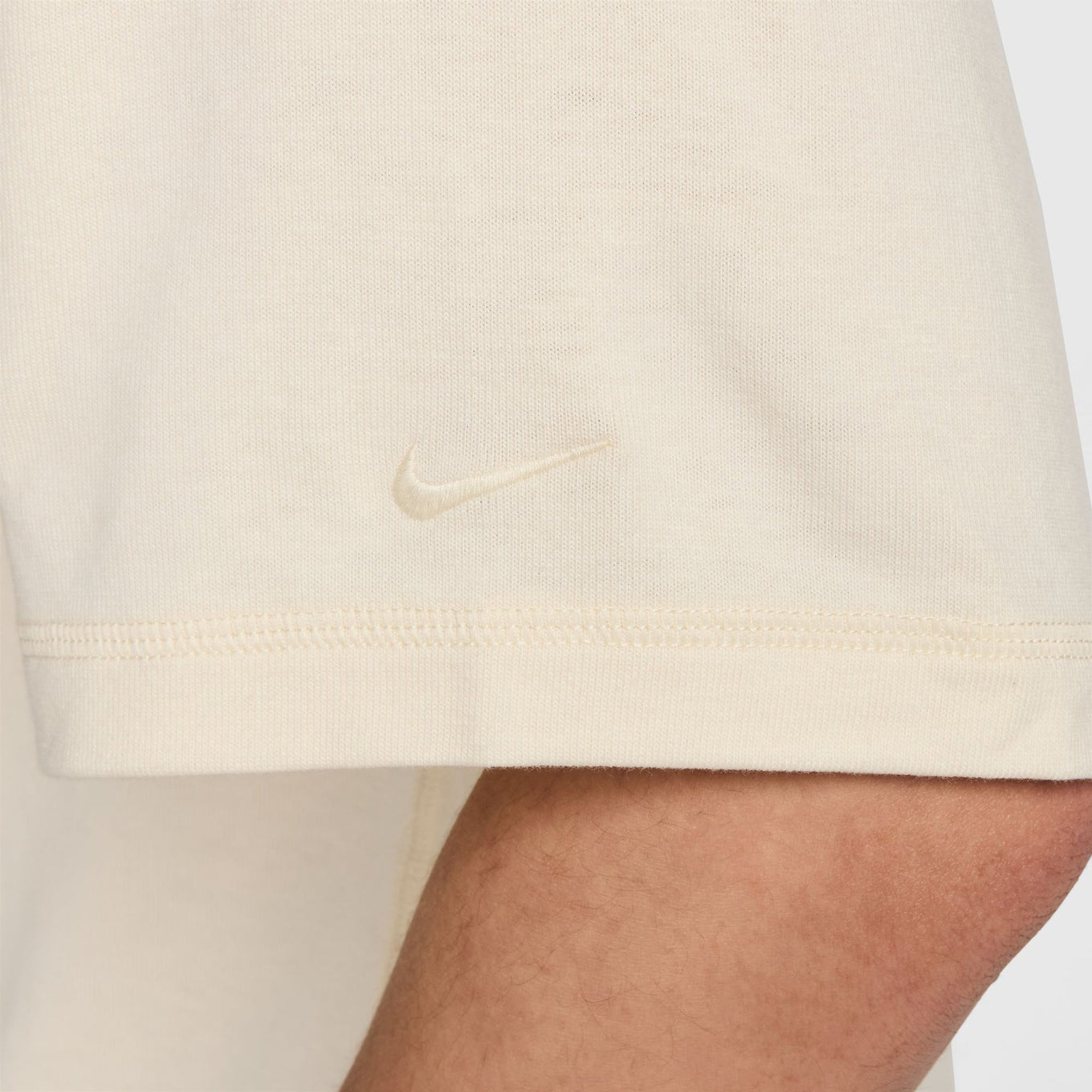 Classic wool-cotton blend tee with slightly loose fit and tonal logo, offering casual style and comfort for everyday wear.