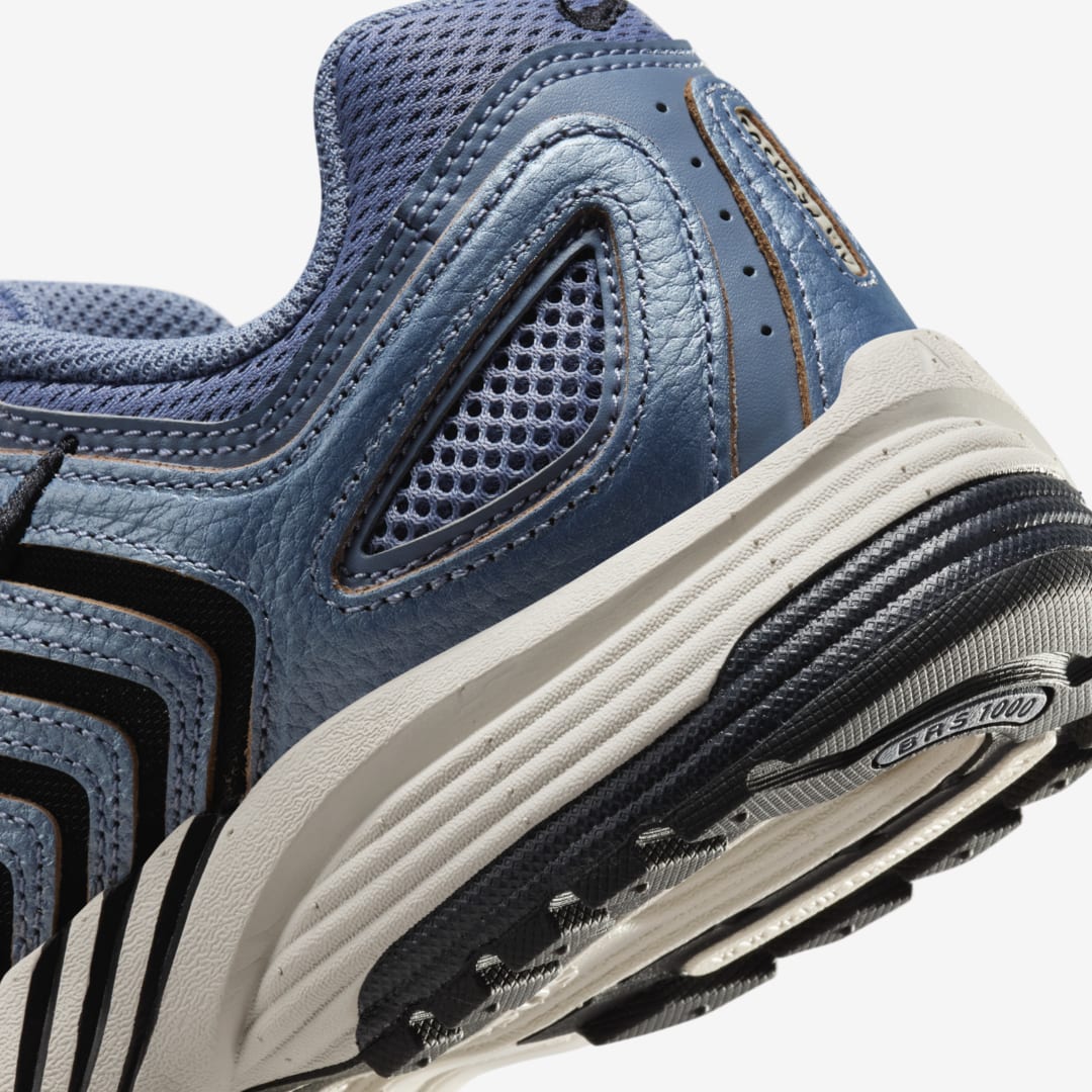 Nike Pegasus 2K5 in Ashen Slate, showcasing subdued palette with earthy accents and raw leather overlays.