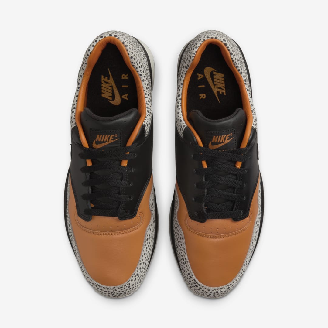 Nike Air Safari OG sneaker with safari print on toe box and heel, black and monarch leather upper, light iron ore midsole, and black rubber outsole


