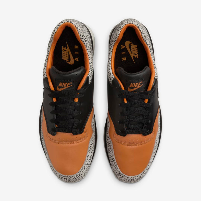 Nike Air Safari OG sneaker with safari print on toe box and heel, black and monarch leather upper, light iron ore midsole, and black rubber outsole


