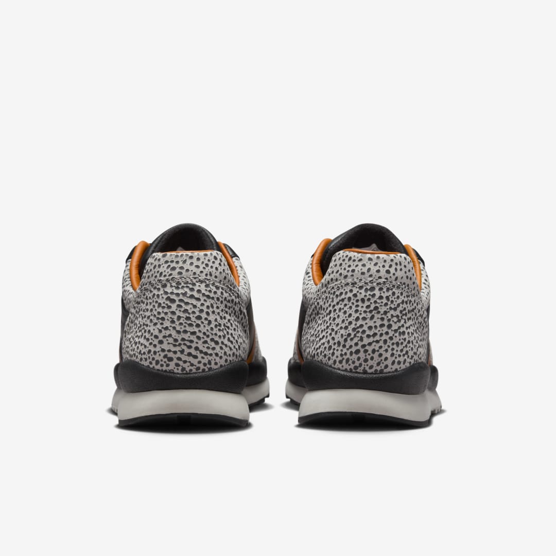 Nike Air Safari OG sneaker with safari print on toe box and heel, black and monarch leather upper, light iron ore midsole, and black rubber outsole


