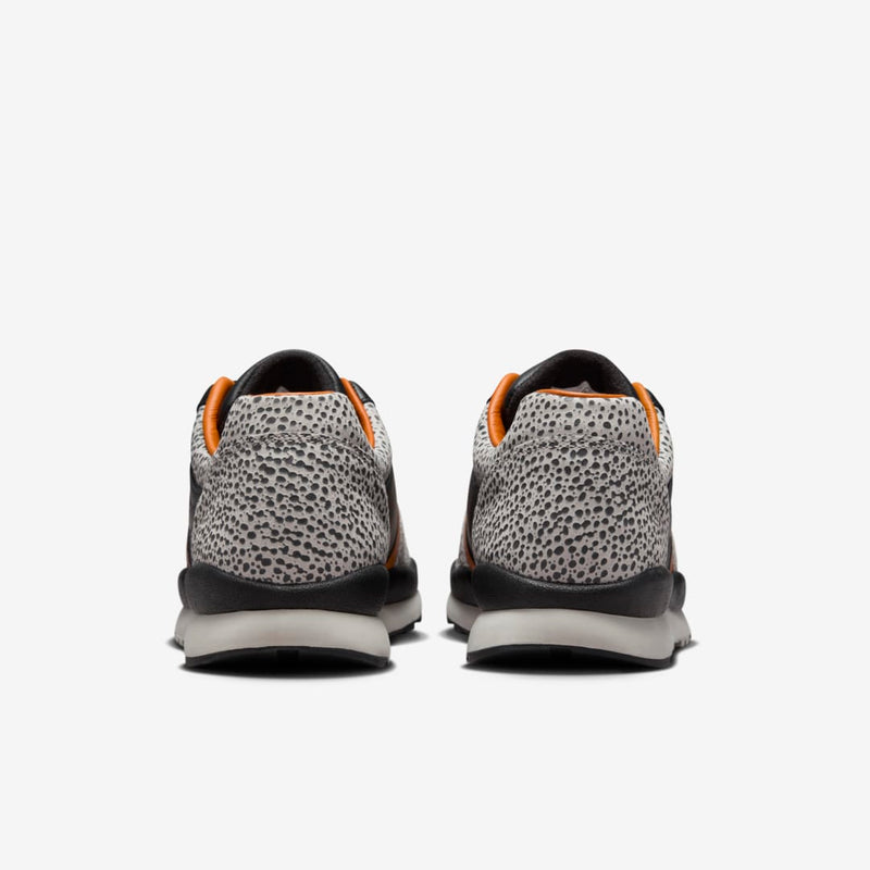 Nike Air Safari OG sneaker with safari print on toe box and heel, black and monarch leather upper, light iron ore midsole, and black rubber outsole


