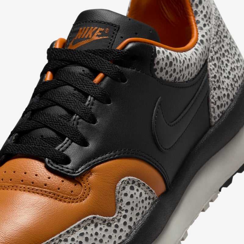 Nike Air Safari OG sneaker with safari print on toe box and heel, black and monarch leather upper, light iron ore midsole, and black rubber outsole


