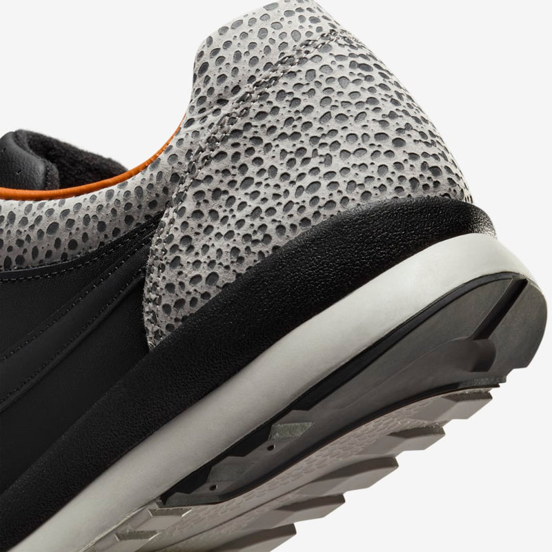 Nike Air Safari OG sneaker with safari print on toe box and heel, black and monarch leather upper, light iron ore midsole, and black rubber outsole


