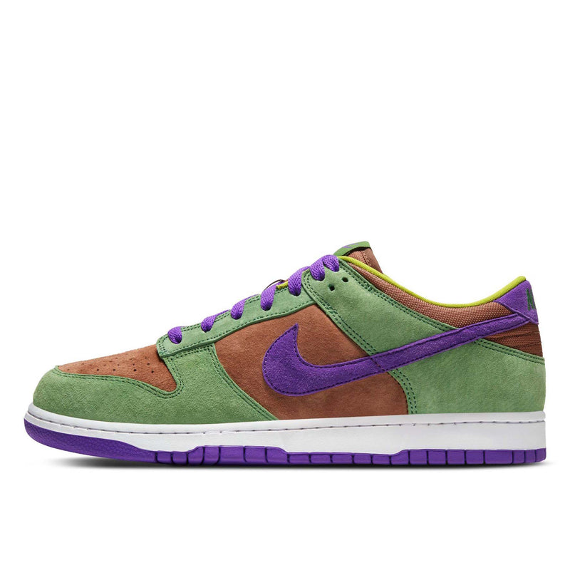 Close-up of the Dunk Low 'Veneer' sneaker featuring a suede upper in green, purple, and brown hues. 