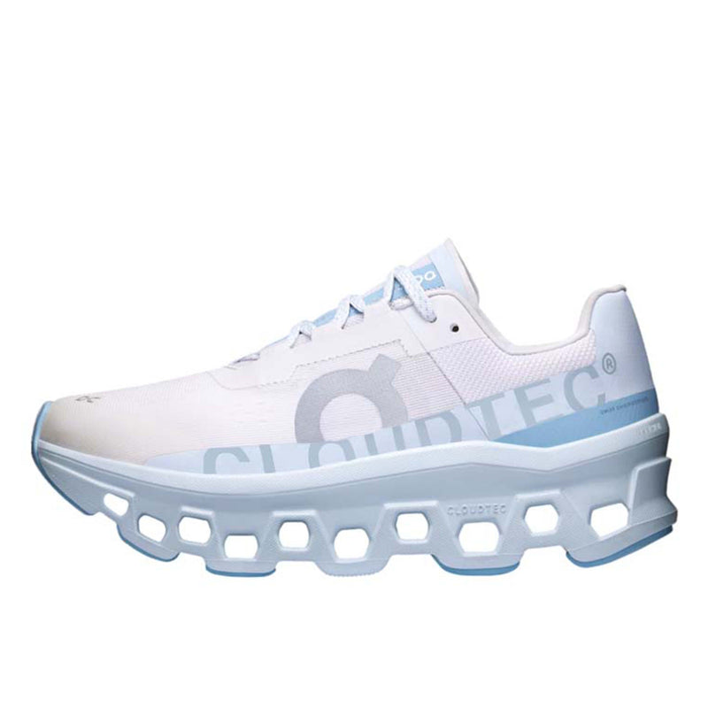 On Cloudmonster WMNS Frost / Wash running shoe with CloudTec cushioning, combining icy blue and neutral tones for a stylish, comfortable design.