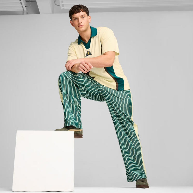 The Players’ Lane T7 pants with signature leg panels, featuring a graphic jacquard knit, combining classic vintage style and modern design elements. 