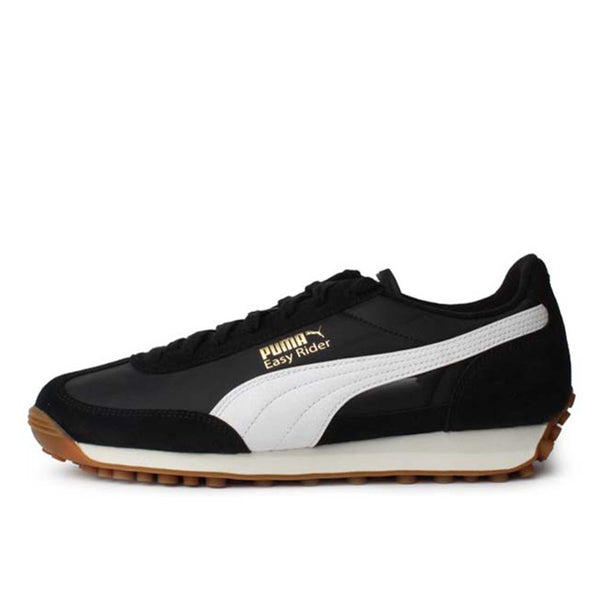 PUMA Easy Rider sneaker with textile base and suede leather overlays, showcasing sleek profile and vintage appeal.