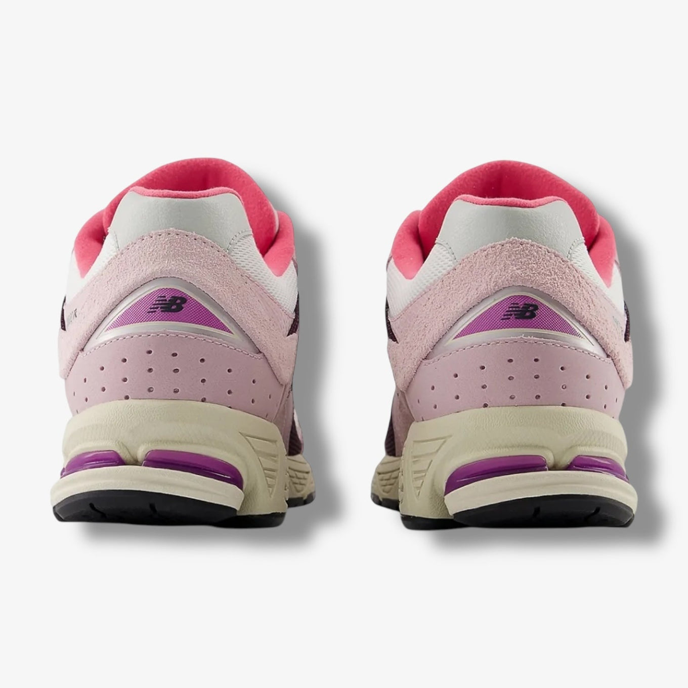 New Balance 2002R sneakers in Passion Fruit and Dragon Berry colorways with suede and mesh upper and ABZORB midsole.