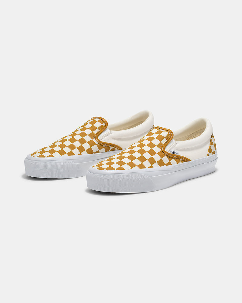 Premium Slip-On 98 Shoes featuring a checkerboard print, full-grain leather collar lining, gloss-finished sidewalls, and Sola Foam All-Day-Comfort.