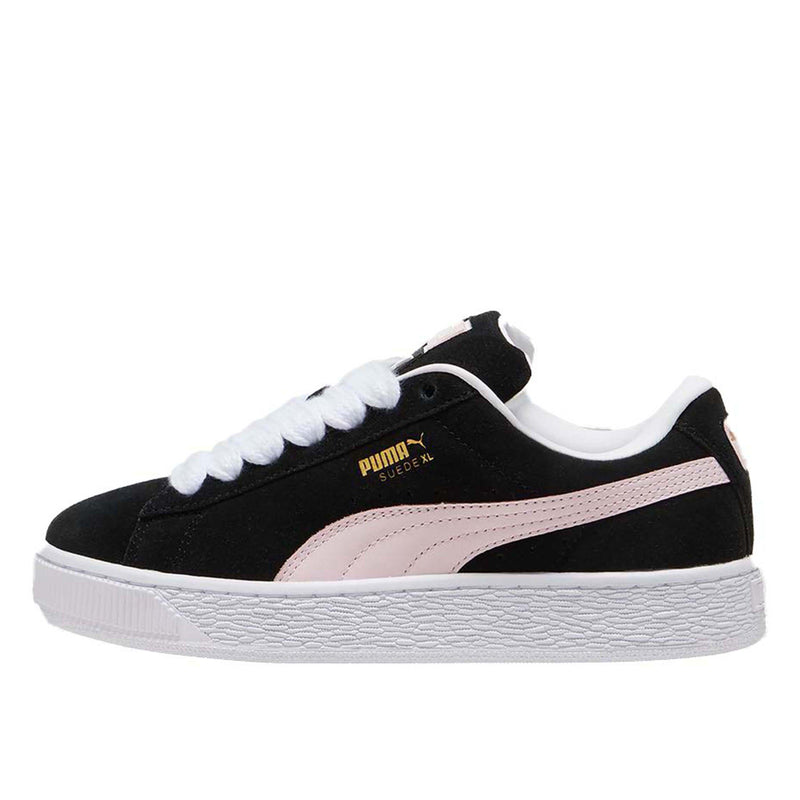 PUMA Suede XL sneakers with a full suede upper, leather Formstrip, exaggerated padded collar and tongue, and chunkier sole.