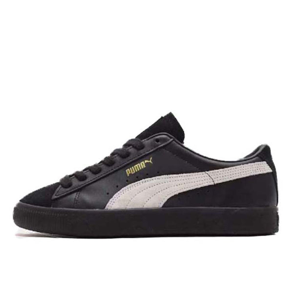 Iconic PUMA Suede by atmos, featuring premium black and white design, blending classic style with modern aesthetics.