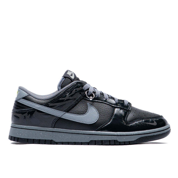 Berlin-inspired Dunk Low sneaker in black and Off-Noir, featuring glossy patent leather accents and reflective tattoo art design on the heel.