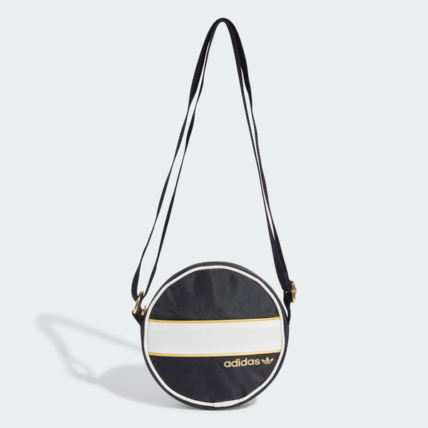 adidas round bag with circular design, metallic gold accents, contrast piping, and adjustable strap for shoulder or crossbody carry.


