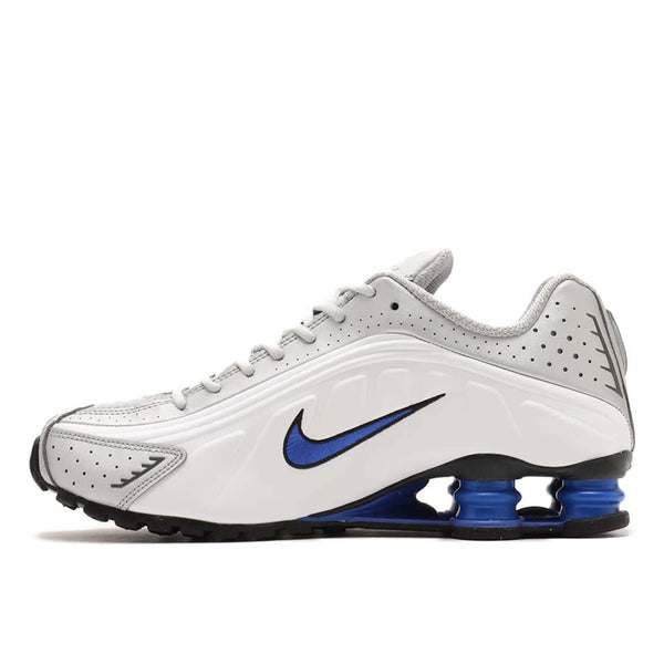 Nike Shox R4 sneaker with futuristic design lines, Shox column in the heel, and bold street-ready style.