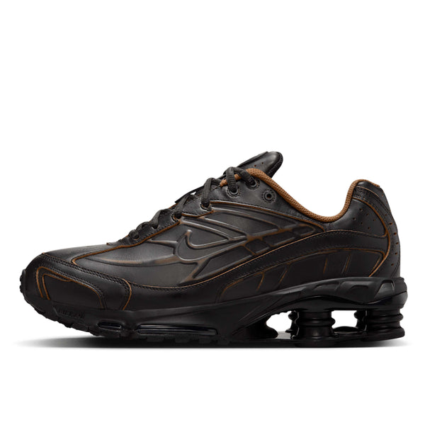 Nike Shox Ride 2 sneaker featuring four Shox columns, Max Air technology, and premium genuine leather upper for durability and comfort.