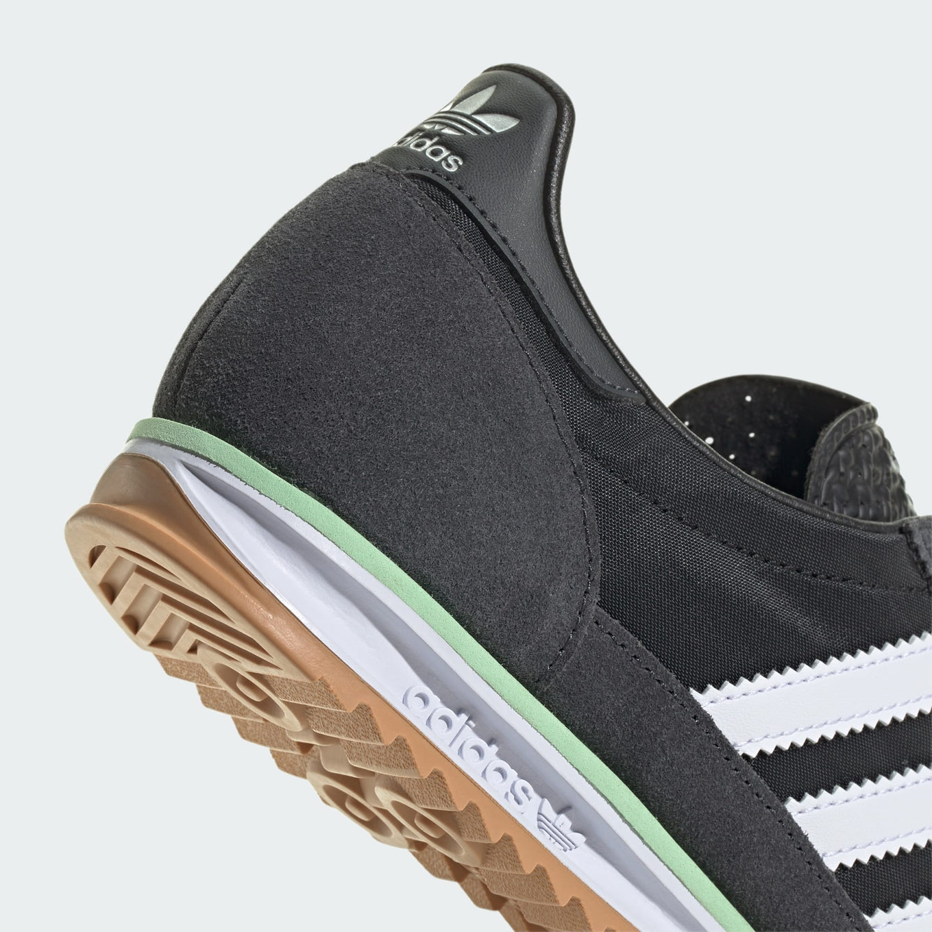 Adidas SL 72 OG shoes with a low-cut nylon upper and suede overlays, showcasing a retro running-inspired design, cushioned EVA midsole, and a rubber outsole for reliable traction.