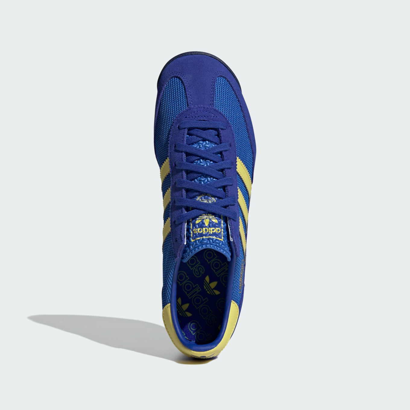 adidas SL 72 RS sneakers with a retro mesh and suede upper, cushioned EVA midsole, and textured outsole for a vintage running-inspired look.