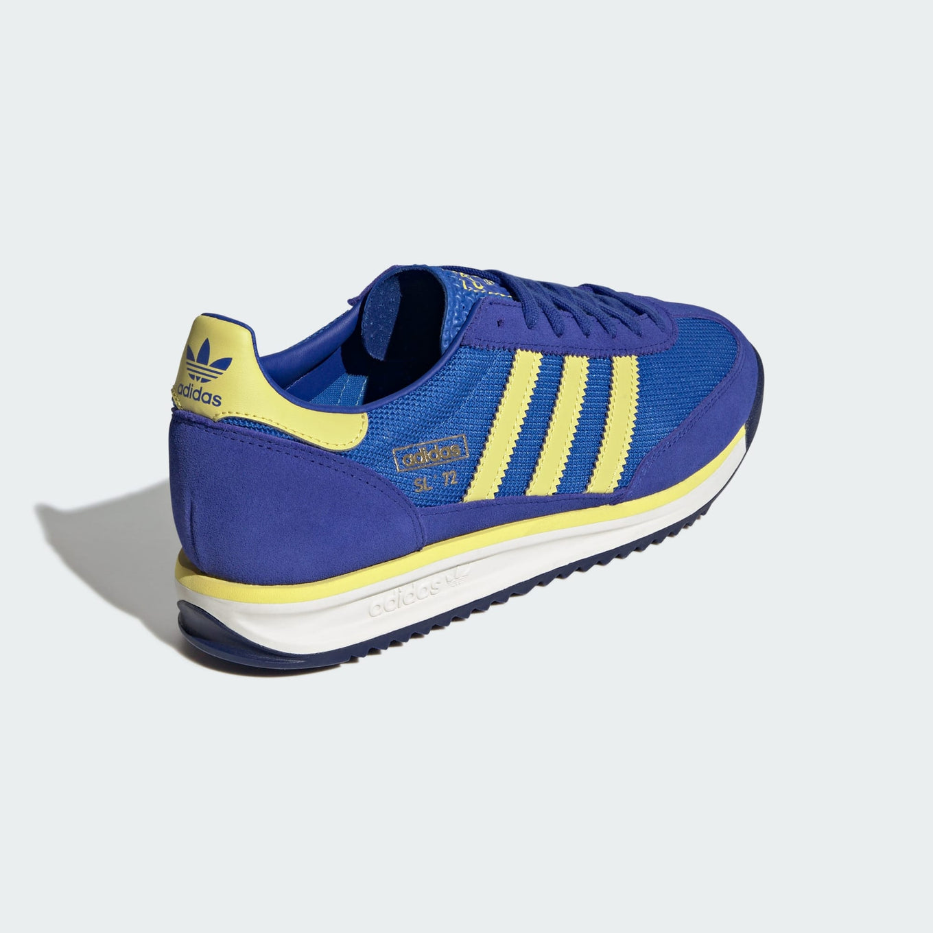 adidas SL 72 RS sneakers with a retro mesh and suede upper, cushioned EVA midsole, and textured outsole for a vintage running-inspired look.